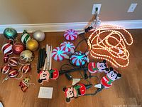 Group view of lights, stakes and ornaments on floor