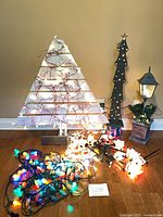 Lot overview showing pallet tree, silhouette tree, lamp-post lantern and assorted light sets