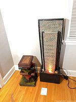 Fountain and faux-book side table together showing scale and operation