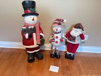 Front view of all three standing Christmas figurines
