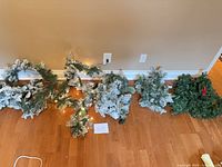 All six lighted garlands shown on floor