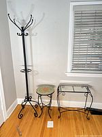 Overall view of coat rack and two tables