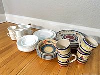 All dinnerware pieces grouped on floor