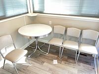 Full set showing table and four chairs