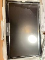 Front view of Samsung 22" TV with protective plastic