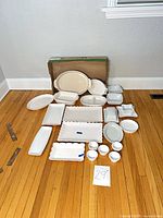 All 21 porcelain pieces laid out on floor