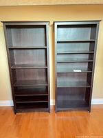 Front view of both matching espresso bookcases