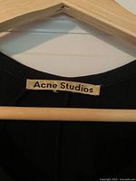 Brand label reading Acne Studios on neckline seam