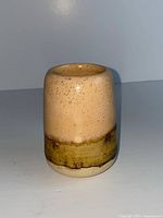 Front view showing peach glaze and green-brown band