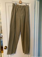 Full front view of khaki trousers hanging