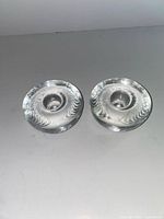 Top angled view showing pair of clear round glass candle holders