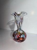 Front view of the clear glass vase with colourful millefiori decoration
