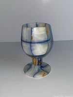 Front view of blue-white onyx goblet showing bowl, stem, foot