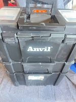 Front view showing three stacked bins, Anvil logo