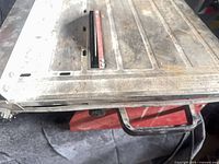 Top view of tabletop tile saw showing condition and integrated ruler markings