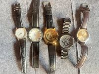 Front view of all five watches laid out