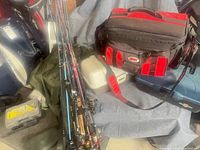 Bundle of fishing rods, tackle bag, tackle boxes and waders