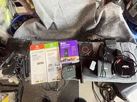 Overall lot showing streaming boxes, HDTV antennas, Roku Express box, remotes, cables