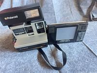 Polaroid Sun 600 camera with Realistic PocketVision 5 TV side by side
