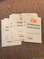 Stack of sealed Public Mobile prepaid SIM card kits