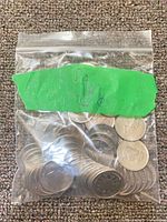 Resealable bag filled with Canadian quarters