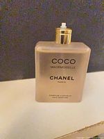 Front view of Chanel Coco Mademoiselle hair perfume bottle without spray nozzle