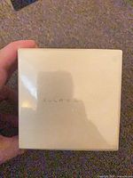 Front of sealed cream box showing subtle Ellas Ears branding
