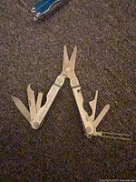 Leatherman Micra opened showing scissors and implements