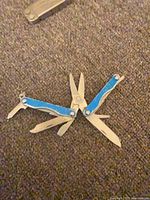 Leatherman Squirt S4 open showing all tools deployed