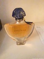 Front view of Guerlain Shalimar perfume bottle showing label and full contents