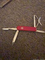 Knife open showing multiple tools