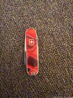 Front view showing sunset graphic scale and Victorinox shield logo