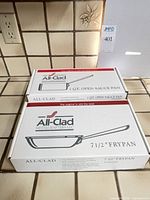 Sealed retail boxes for 1 qt sauce pan and 7.5 in fry pan