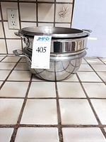 Stacked pots showing exterior finish and handles