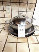 Both cookware pieces stacked with lid on top