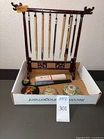 Overall lot showing wooden brush stand, hanging brushes, paint box, ink stone, trinket boxes in tray