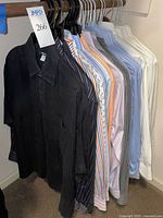 Row of shirts on hangers showing variety of colours and patterns