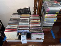 Tray and stacked columns of CDs showing quantity and variety