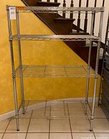 Front view showing four chrome wire shelves and overall structure