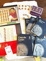 Overall lot showing coin folders, 1992 proof set, loose coins, stamp album pages