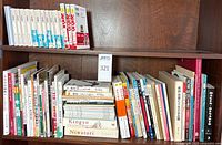 Both shelves showing full lot of Japanese books
