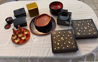 Overview of all lacquerware pieces on table