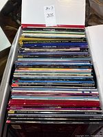 Top view of packed box showing stacked LaserDisc titles
