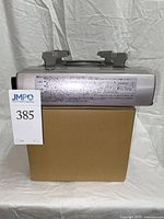 Iwatani gas stove canister side resting on boxed rice pot