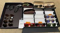 Overall lot showing sunglasses, cases and visor clips