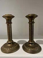 Front view of both matching brass candlesticks