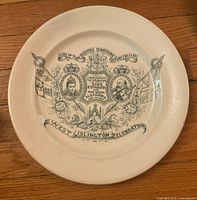 Front view of commemorative plate showing design and inscriptions