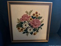 Full view of framed needlework artwork