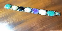 Full view of sterling bracelet showing eight cabochon stones