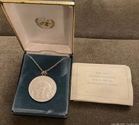 Pendant on chain in original Franklin Mint box with insert visible